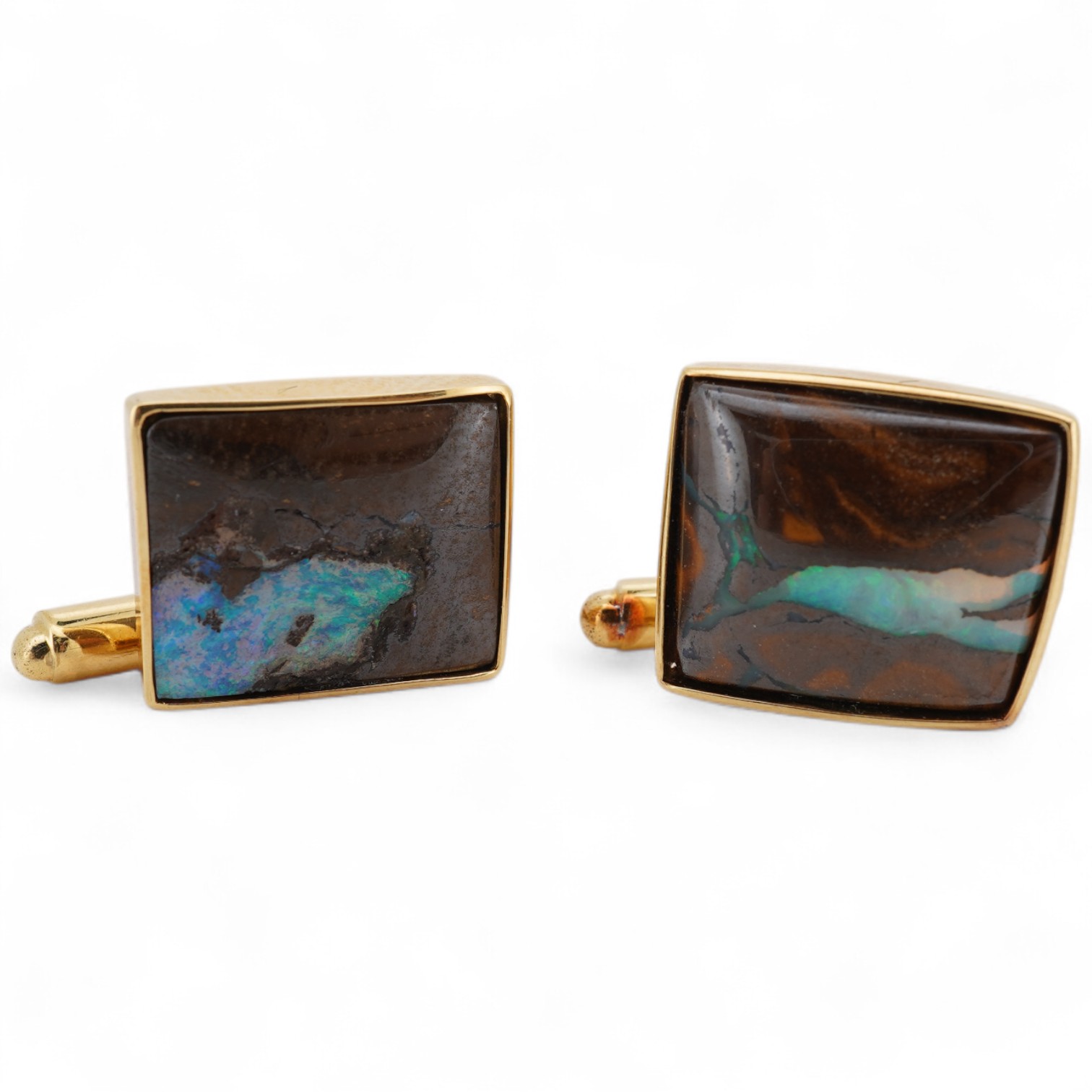 A modern pair of 18ct gold and opal set cufflinks by Geoffrey Turk Ltd, London, 13.5mm by 11mm, gross weight 7.8 grams, with original box.
